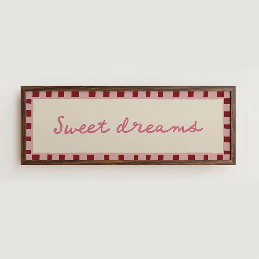 Framed sign with 'Sweet dreams' text on a white wall